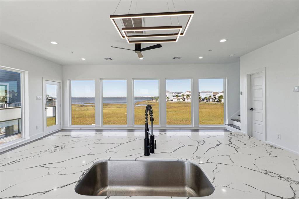 Wash the dishes while watching the boats go by from the kitchen sink offering captivating bay views
