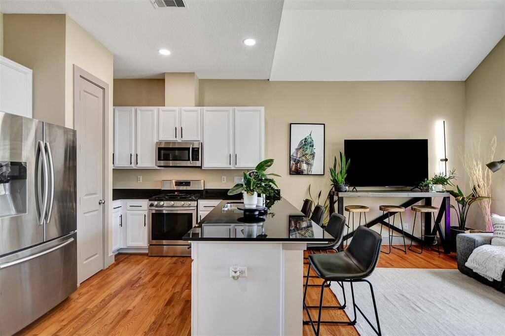 kitchen includes stainless steels appliances and lots of cabinet space.