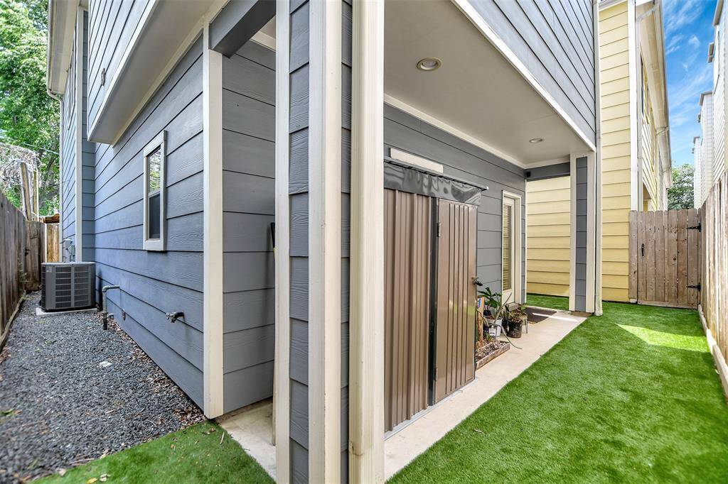 Backyard includes a small shed.