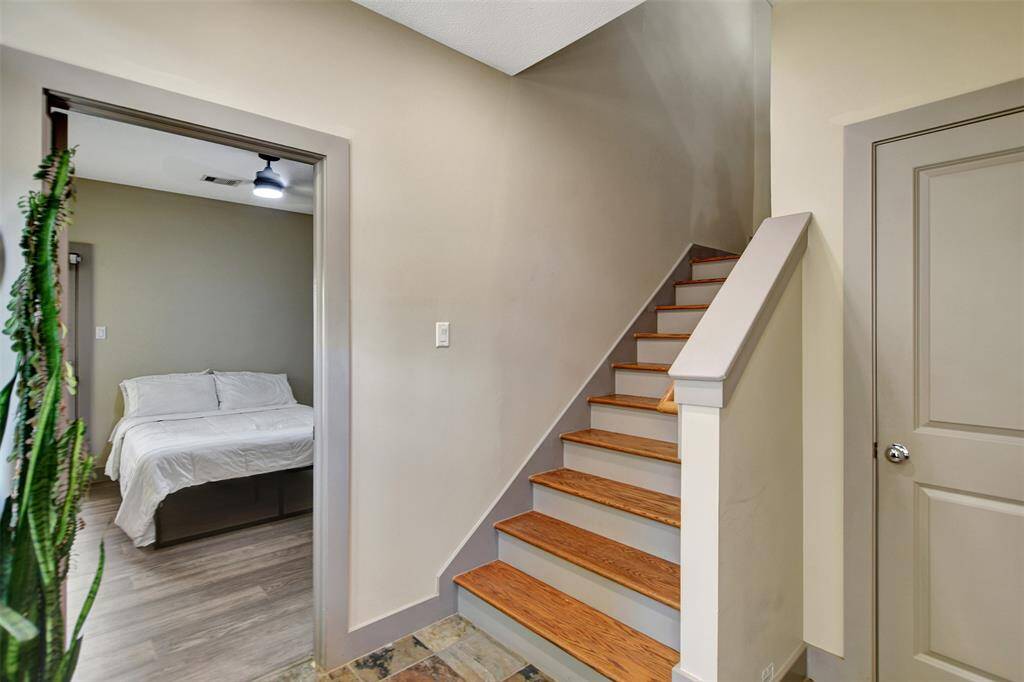 First floor. Garage to the right with a coat closet and a bedrrom with full bath to the left.