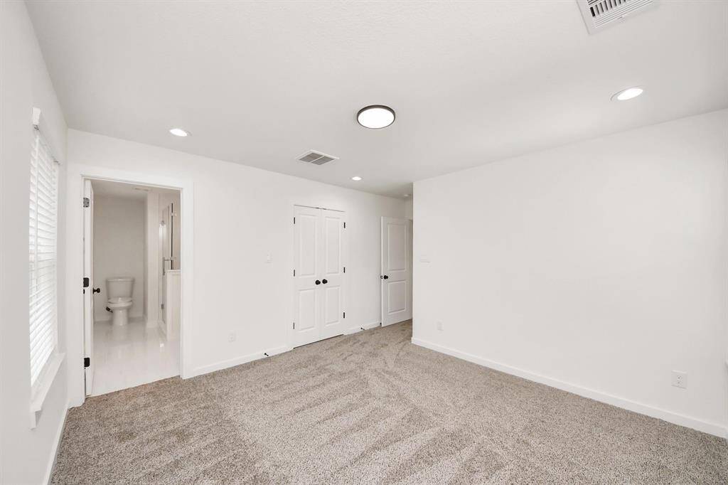 large primary bedroom with bathroom