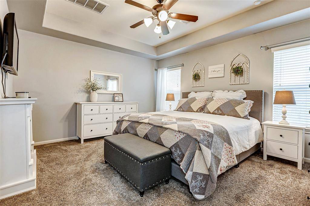 Primary bedroom with trayed ceiling