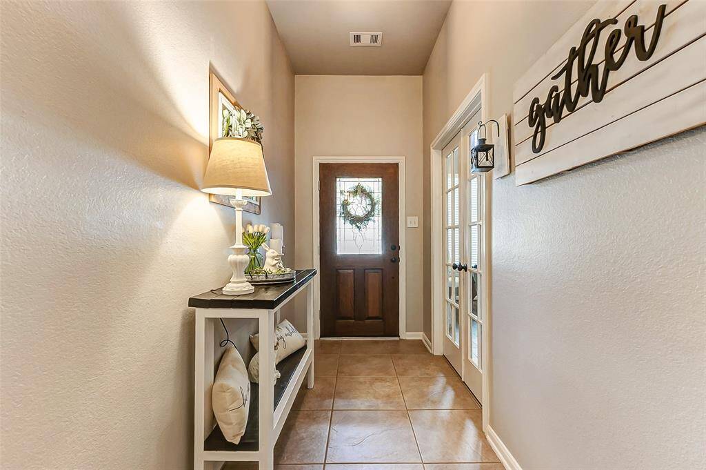 Beautiful entry with office/flex space to the left