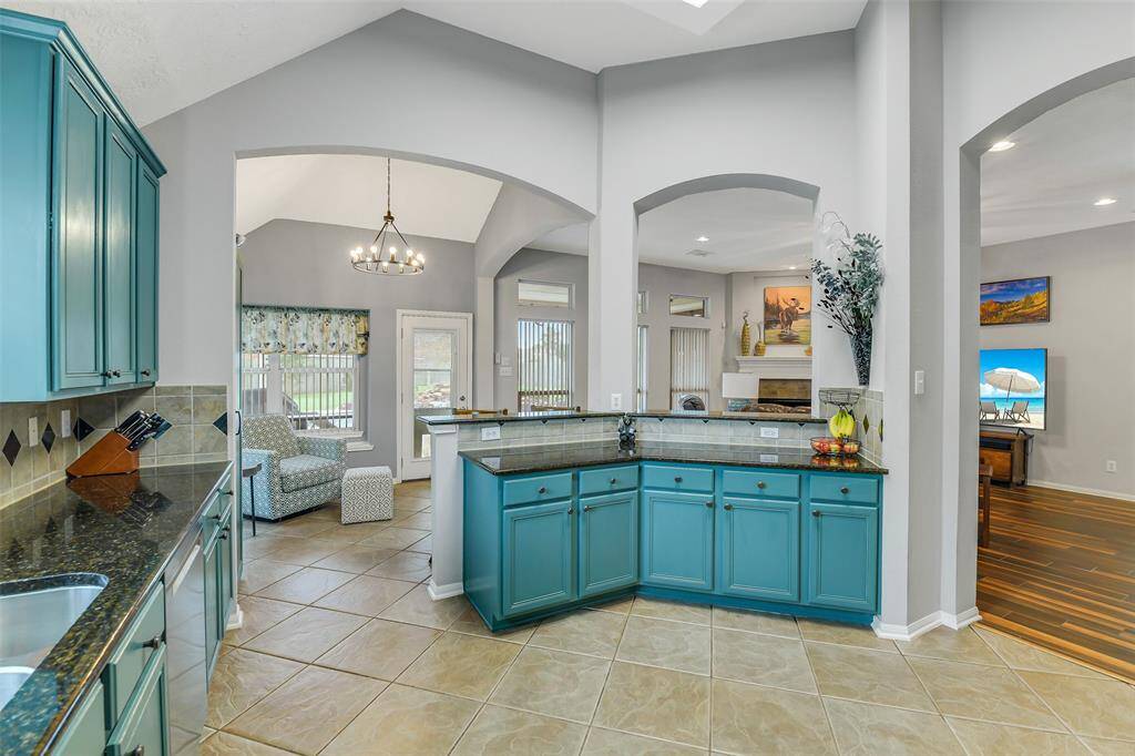 The kitchen has great views of the dining room, breakfast room, and living room for open-concept living.