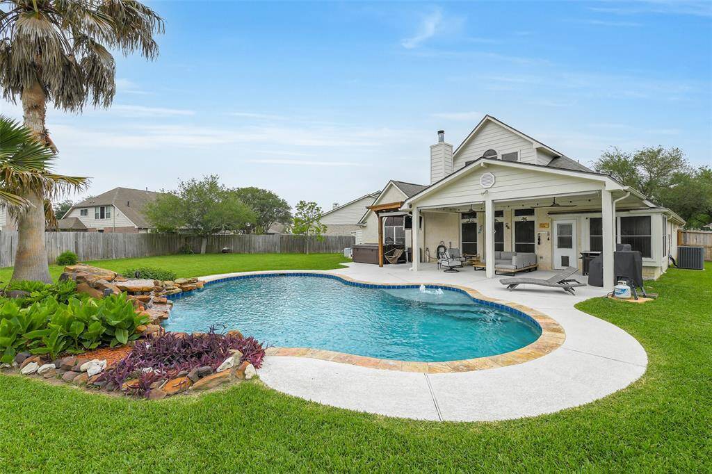 This gorgeous pool includes a rock and waterfall feature, tanning ledge, and can be heated!