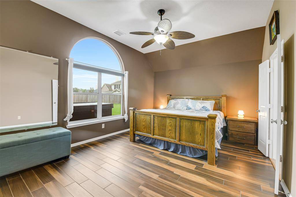 Stepping back into the home, here is a look at the large primary suite.