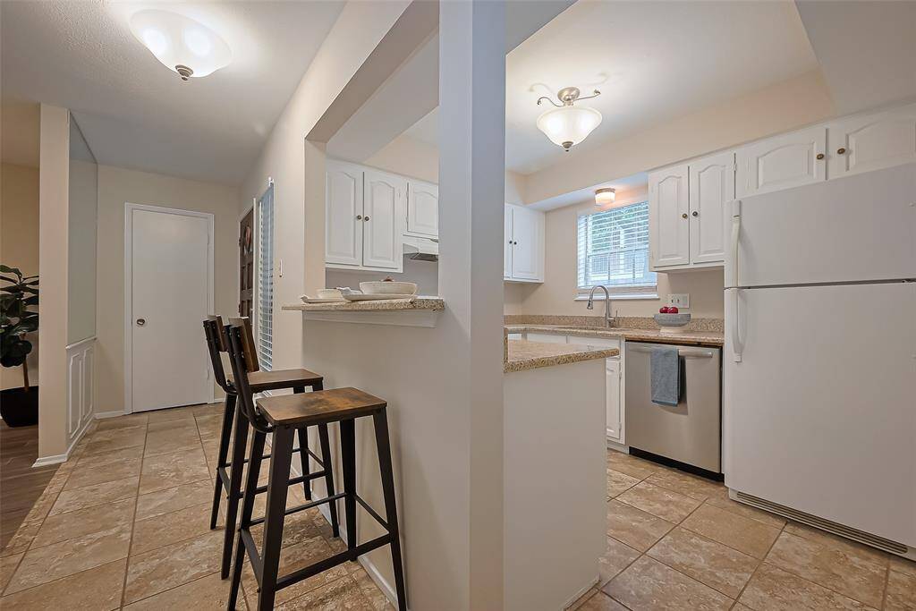 The cozy breakfast bar is perfect for enjoying your morning coffee, quick bites, or casual meals on the go—all while staying connected to the heart of the home.