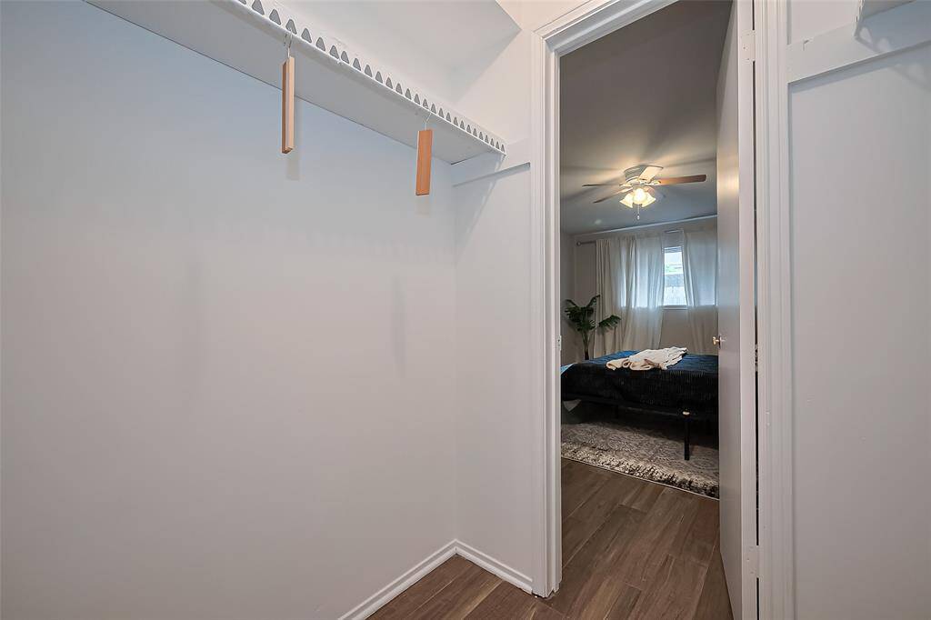 The spacious walk-in closet offers plenty of room for clothing, shoes, and accessories—keeping everything organized and within reach.