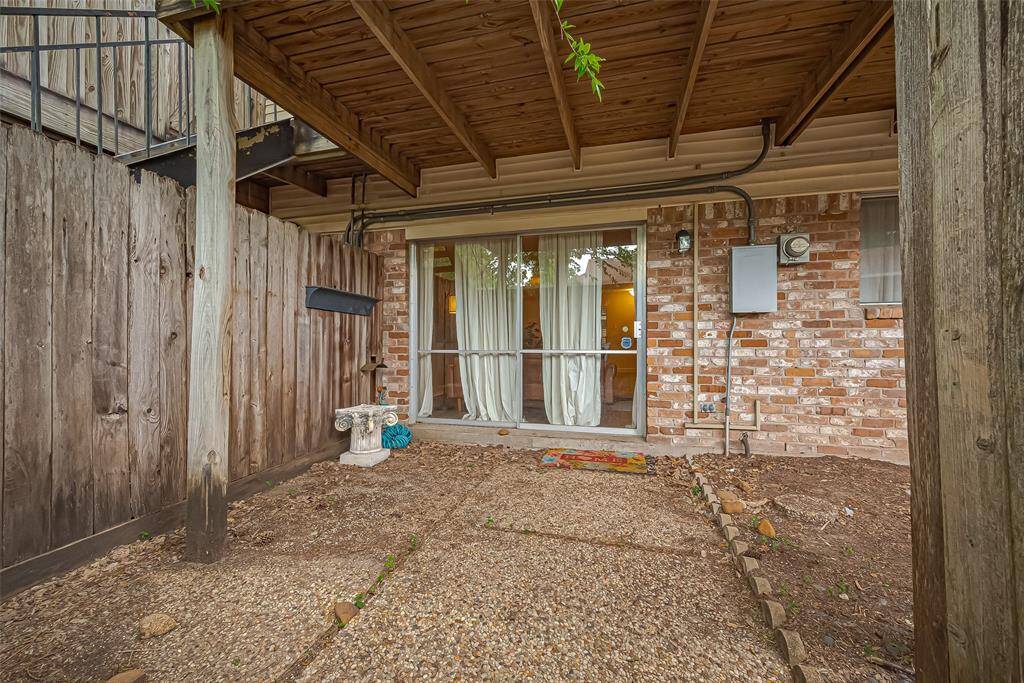 The paved patio area offers a low-maintenance space to relax, entertain, or enjoy a morning coffee—just steps from your living room.