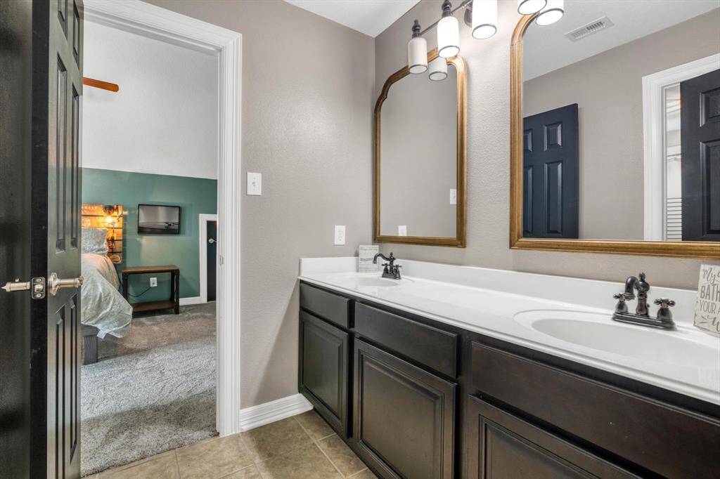 Jack and Jill bathroom between the two large 23x12 bedrooms.