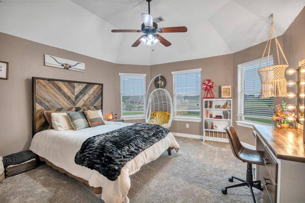 This room faces the back yard, just over the primary bedroom.