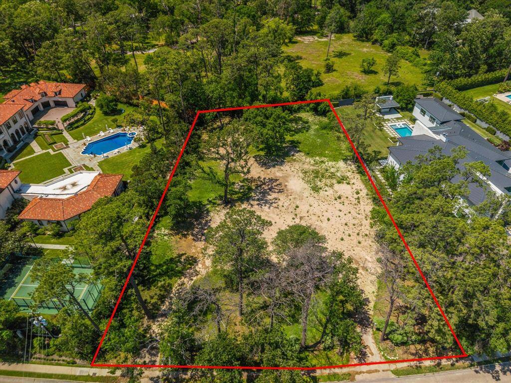 Incredible opportunity to build your dream home on a 1.2 acre lot in one of Memorial's mostprestigious neighborhoods, Memorial Close In.Aerial View of 8827 Memorial Dr-Boundary line is approximate. Pleasereference 2025 survey in MLSattachments.