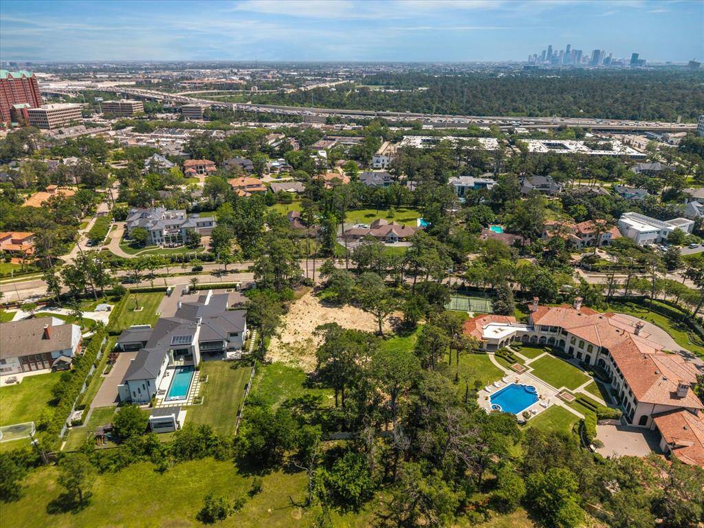 Aerial view of 8827 Memorial Dr. Boundary line is approximate. Please reference 2025 survey.