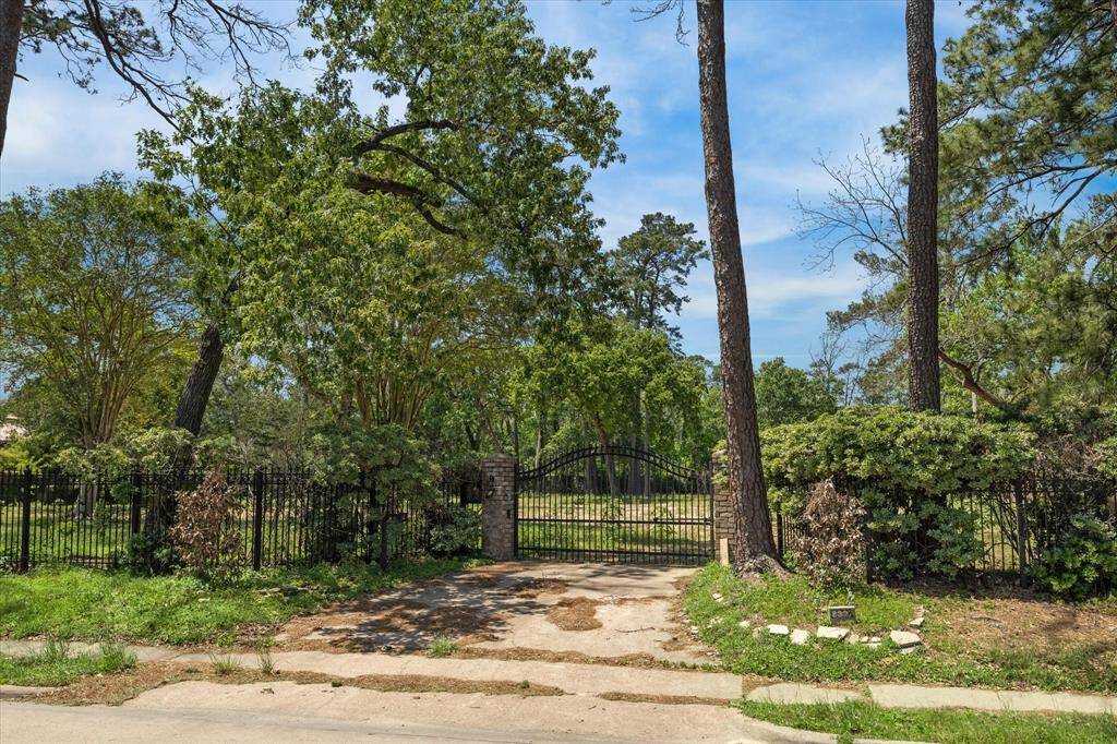 Lot features beautiful mature trees - possibilities are endless with plenty of space for a custom home,pool, circle drive + side driveway, large green space and more.