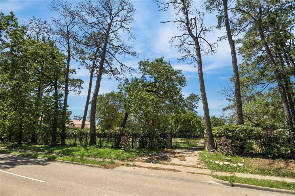 Lot features beautiful mature trees - possibilities are endless with plenty of space for a custom home,pool, circle drive + side driveway, large green space and more.