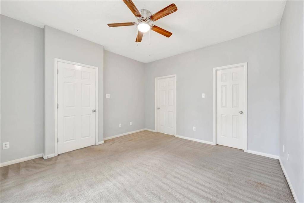 Primary suite is located on the first floor with a walk-in closet.
