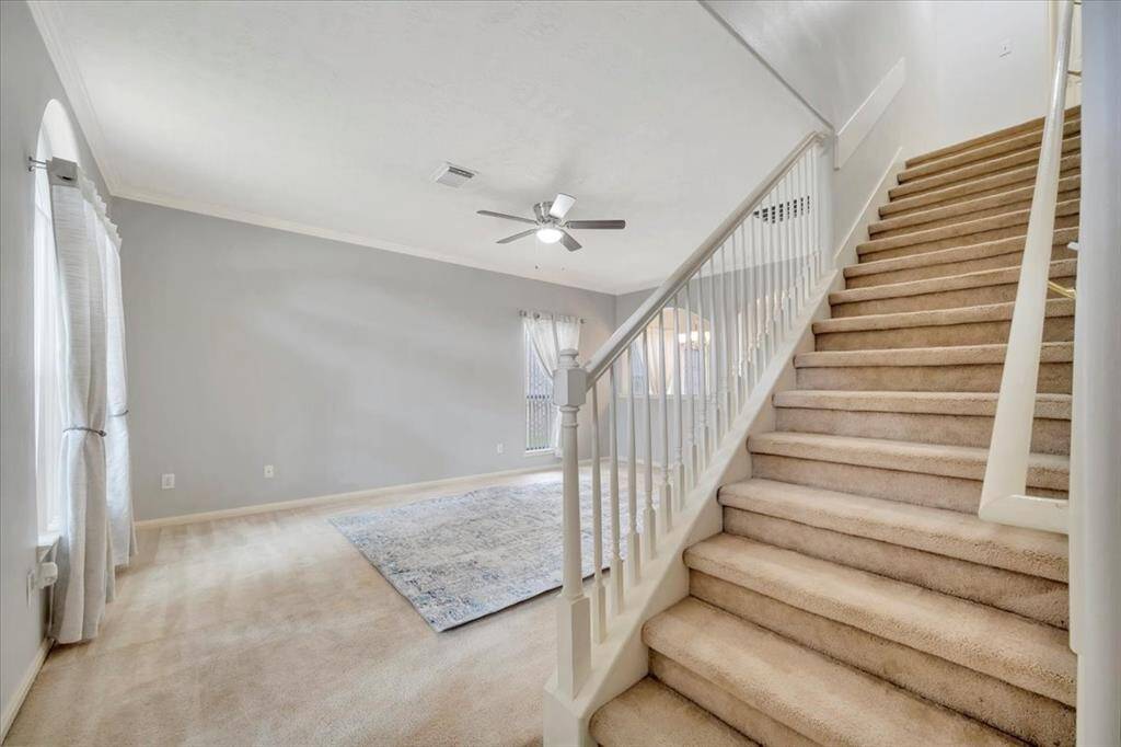 Stairs leading to second primary suite.