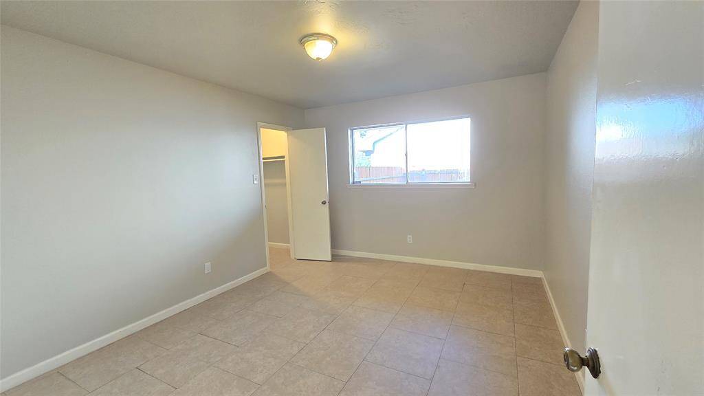 Third bedroom flooded with natural light and generous in size, this charming bedroom offers a peaceful retreat complete with a spacious walk-in closet.