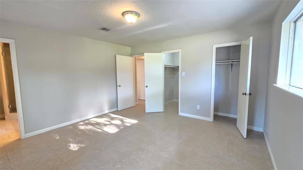 A true retreat, the owner’s suite offers abundant natural light and the added convenience of two closets—one spacious walk-in and one standard—for effortless organization.