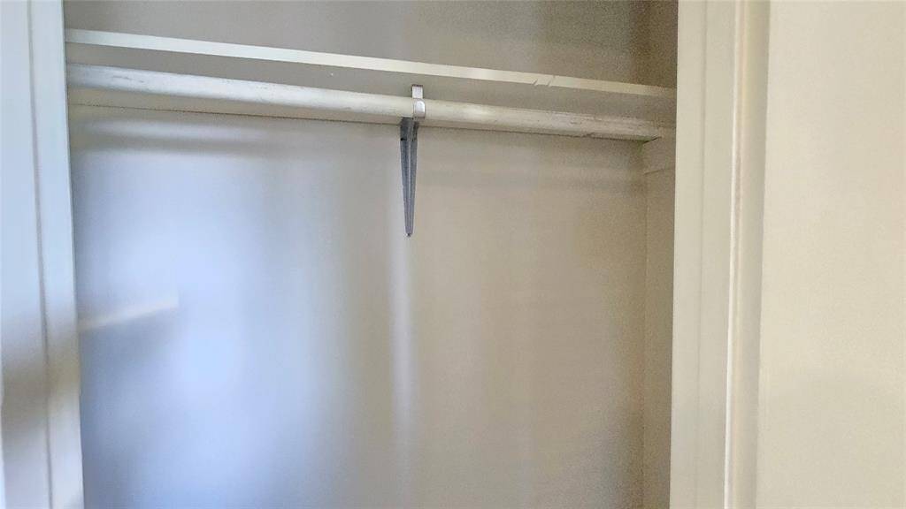 The flat closet offers convenient storage for everyday essentials, keeping everything within easy reach while maintaining a clean, streamlined look.