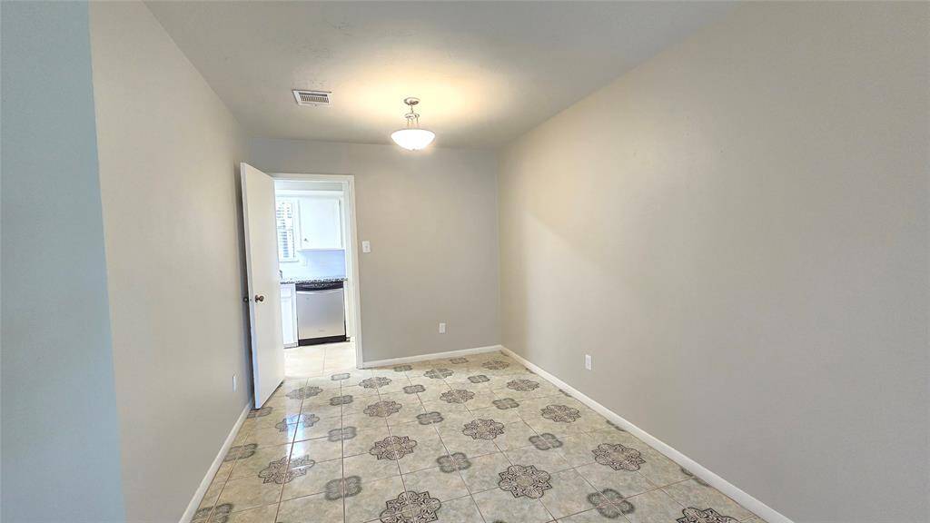 This spacious formal living & dining room offers privacy with a door, yet provides seamless access to the kitchen—ideal for enjoying quiet moments or entertaining with ease
