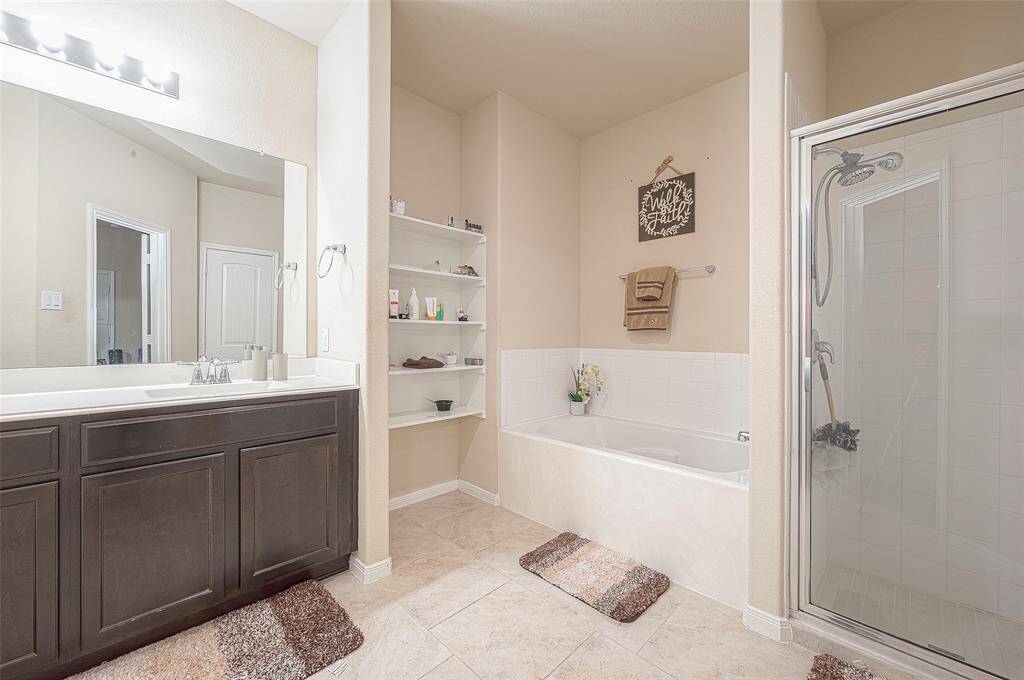 Relaxing ensuite with soaking tub and walk-in shower.