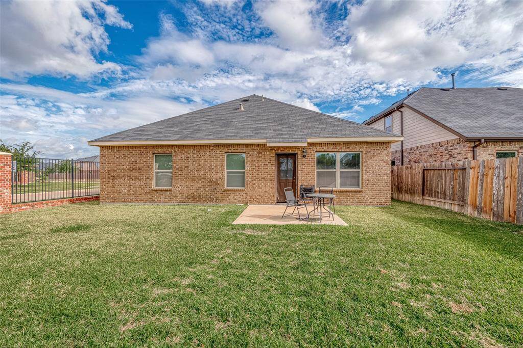 Step out to the spacious backyard with an open patio!
