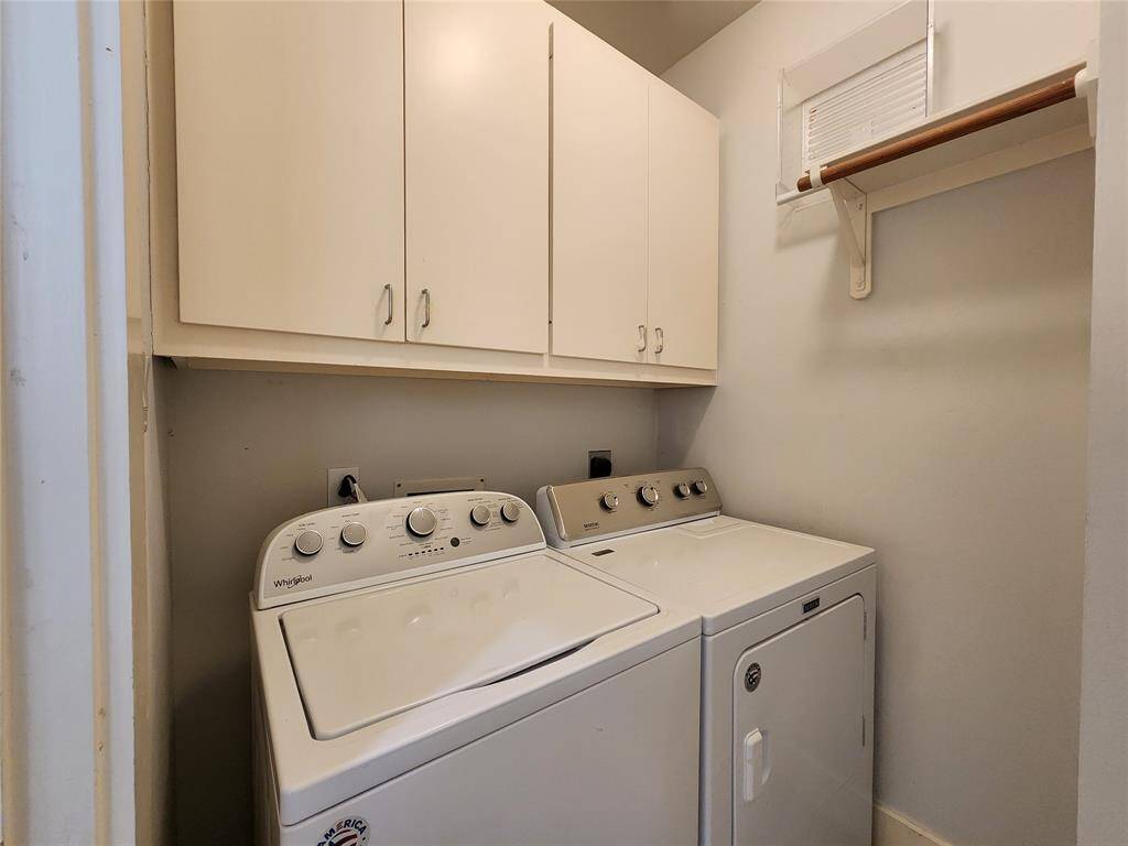 Utility room with washer and dryer