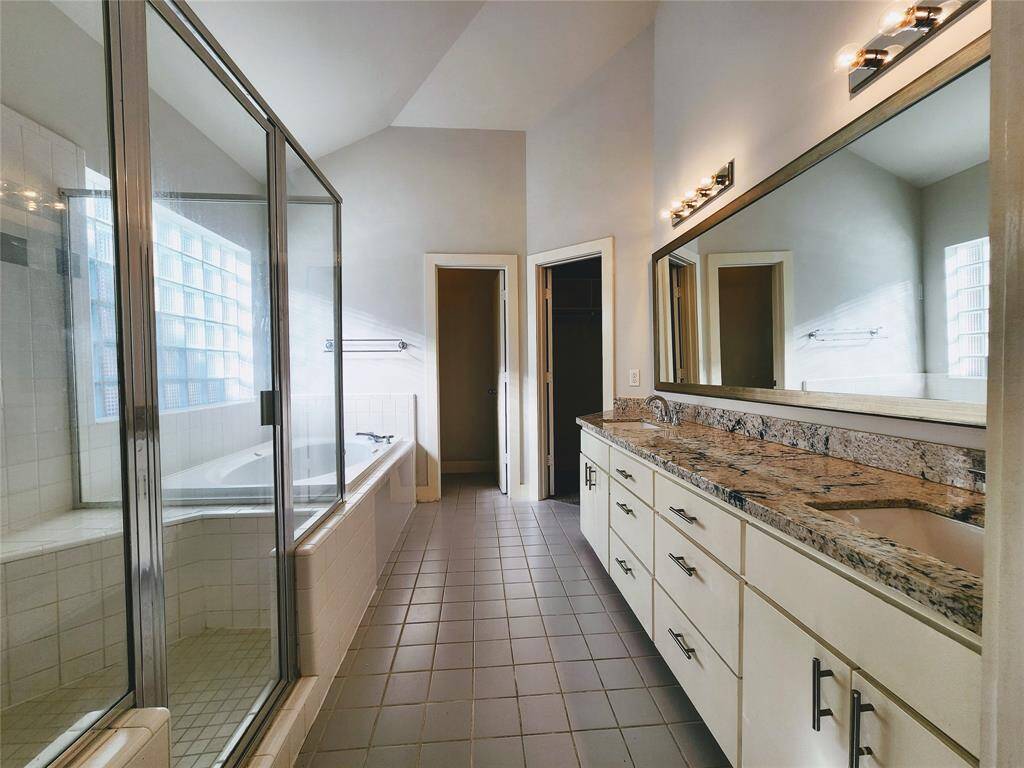 Master bathroom with duo sinks vanity, separate shower, jacuzzi tub
