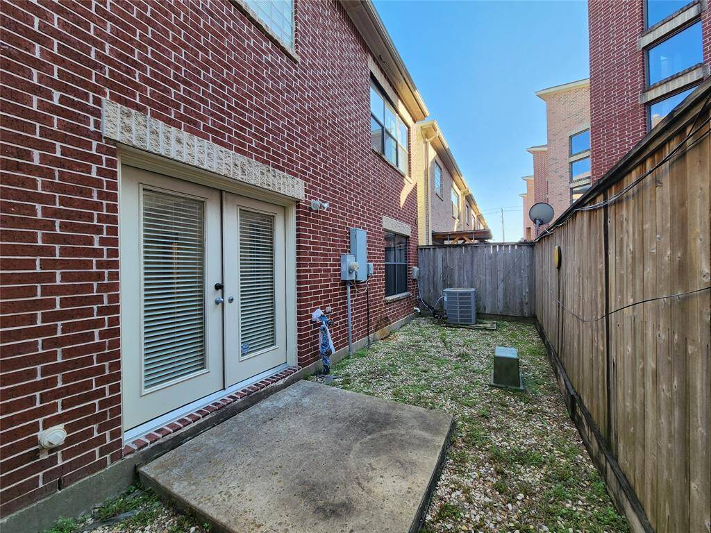 Back yard with a patio outside the double door