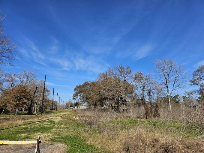 The property features accessible light poles and road access on both the front and back