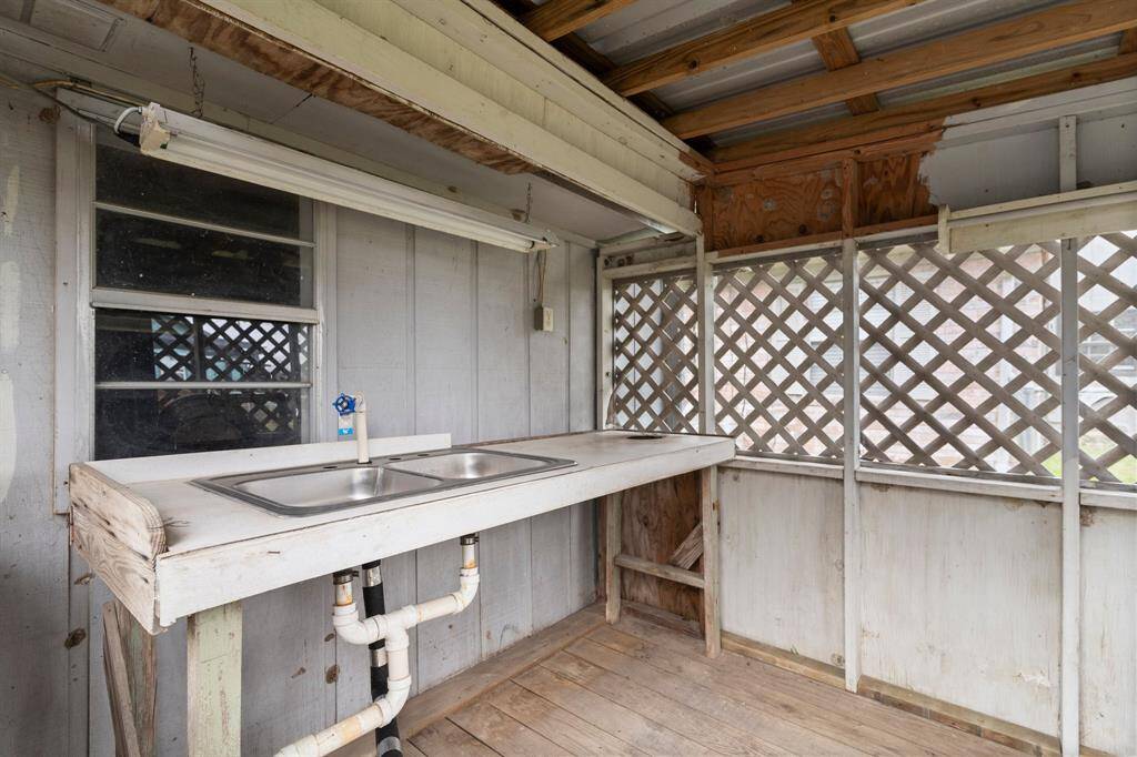 Laundry room with a small window providing natural light.