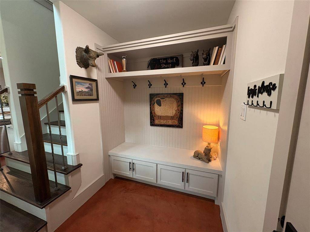 The cubby area or drop zone. This custom built in cabinet is not only pretty but functional. A great spot for keys, coats, and shoes.