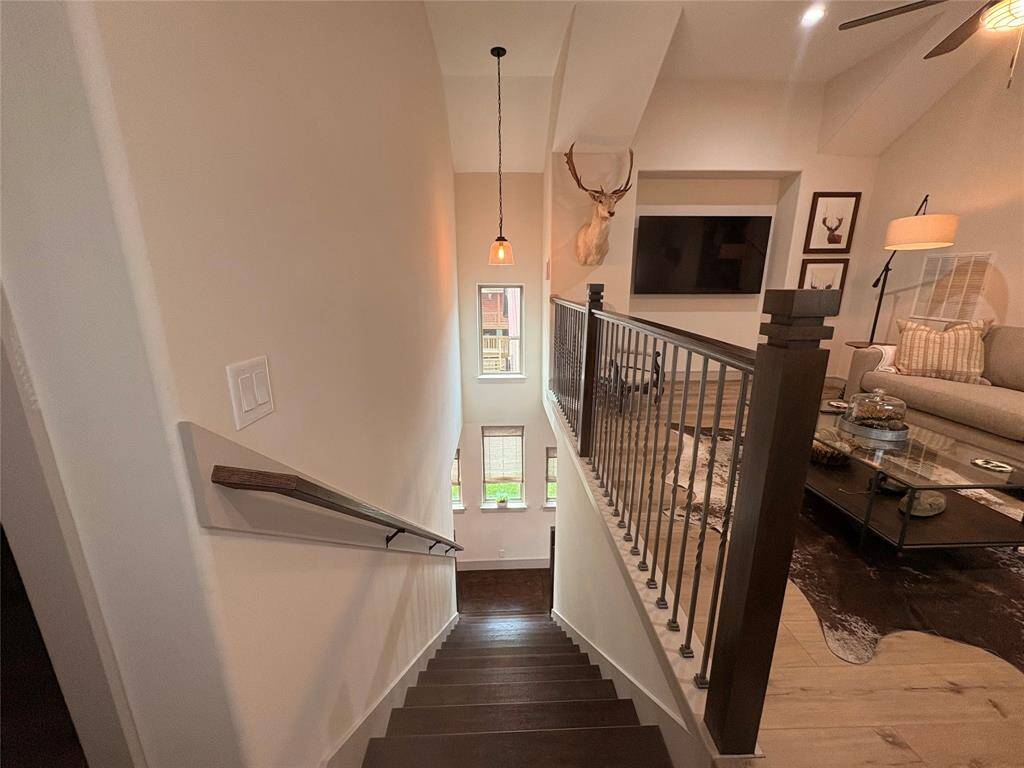 Standing at the top of the stairs and looking into the game room or flex space. This large room is great for a second TV viewing area or home office.