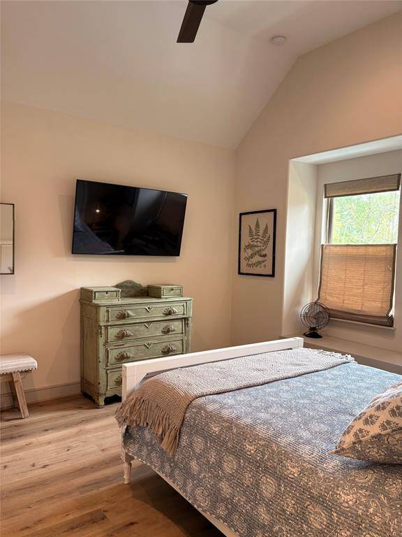 Here's another picture of the second bedroom that's upstairs. This large bedroom has a vaulted ceiling, two large windows and window seat, ceiling fan, and large walk in closet.