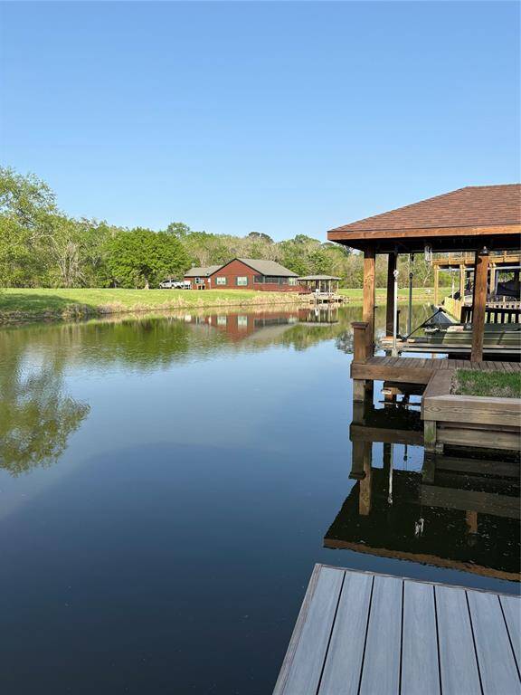 This canal is calm and quiet and a great spot to fish or watch the water fowl. This picture also shows the deck with durable composite decking.