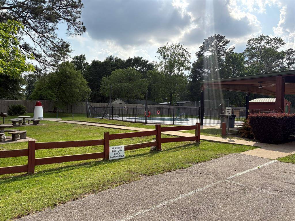 Neighborhood pool 1 and picnic area. This parking lot also host food trucks on the weekends.