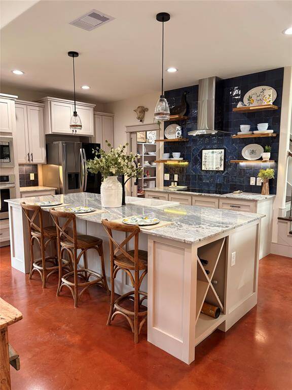 This beautiful kitchen has tons of cabinets for all your storage needs. Soft close cabinets and drawers, wine storage and plenty of work space make it dream to cook in
