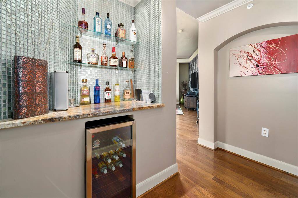 A look as you're leaving the hallway for the open-concept living room and kitchen.