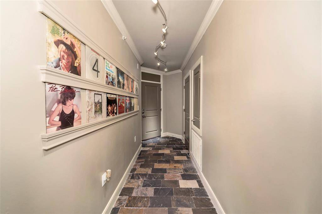 A look at the long hallway as you exit this condo unit.