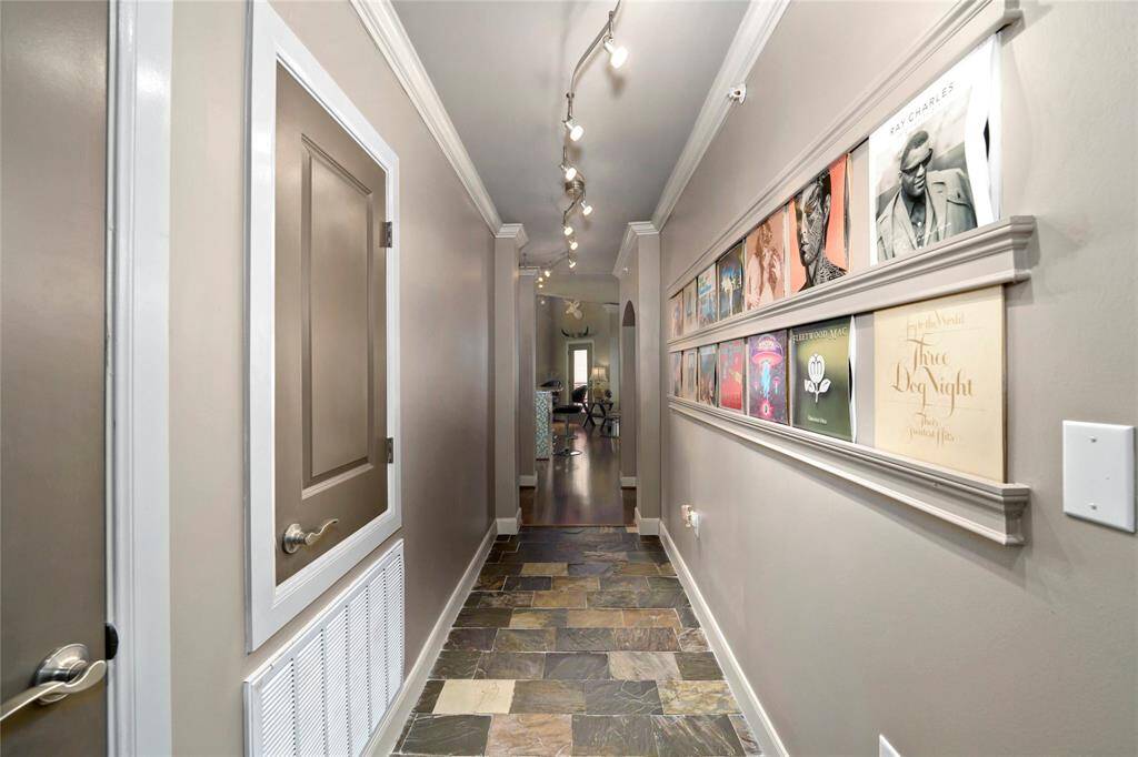 Welcome inside this unit on the top floor (4th floor). Long hallway with built-in platforms for your artwork on the right. Coat closet to your left. Smaller door is your HVAC access. AC was replaced in April of 2022.