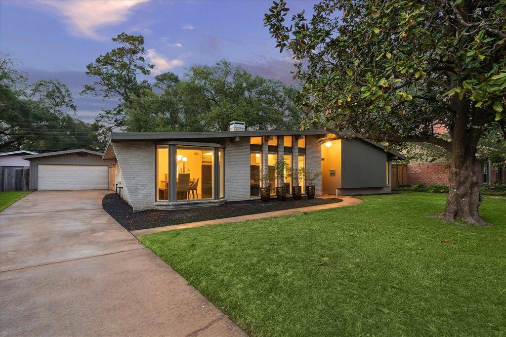 A meticulously maintained Mid-Century marvel with classic roof lines and clerestory window walls