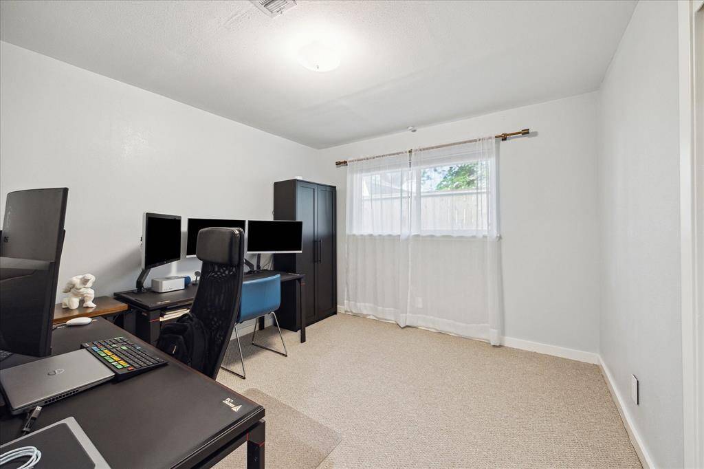 Middle guest bedroom currently used as an office
