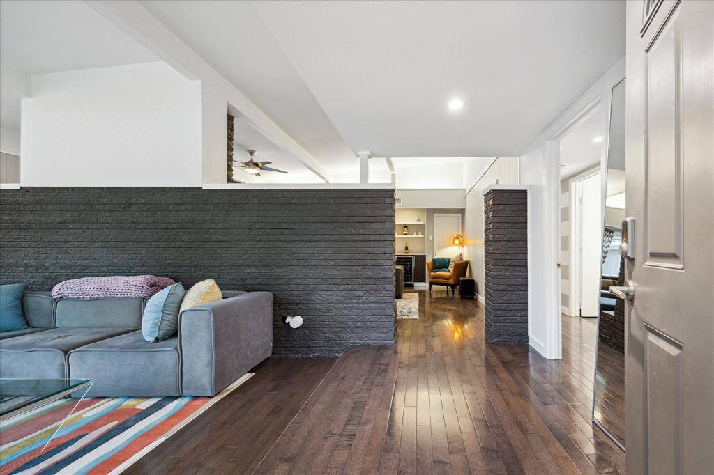 Classic Mid-Century modern details like this brick half wall and open floor plan
