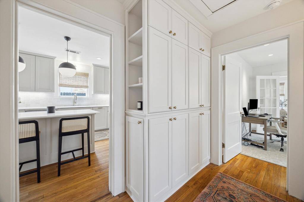 Custom designed pantry area with wicker-paneled cabinets.