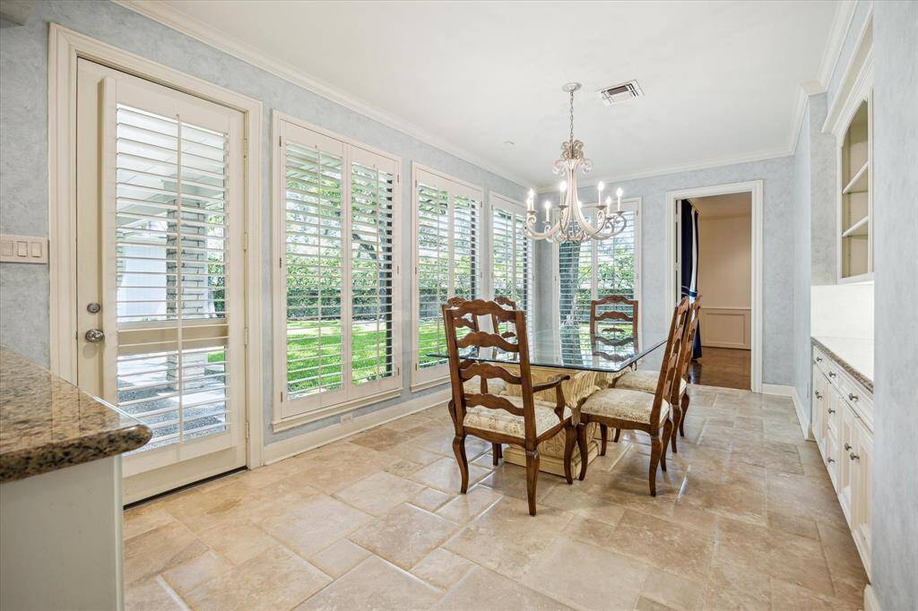 view of breakfast room and door to backyard