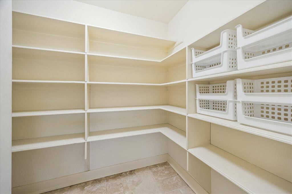 huge walk in pantry adjacent to kitchen desk