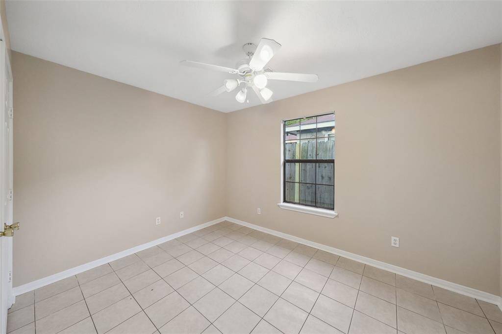 Secondary bathroom has granite counter top.