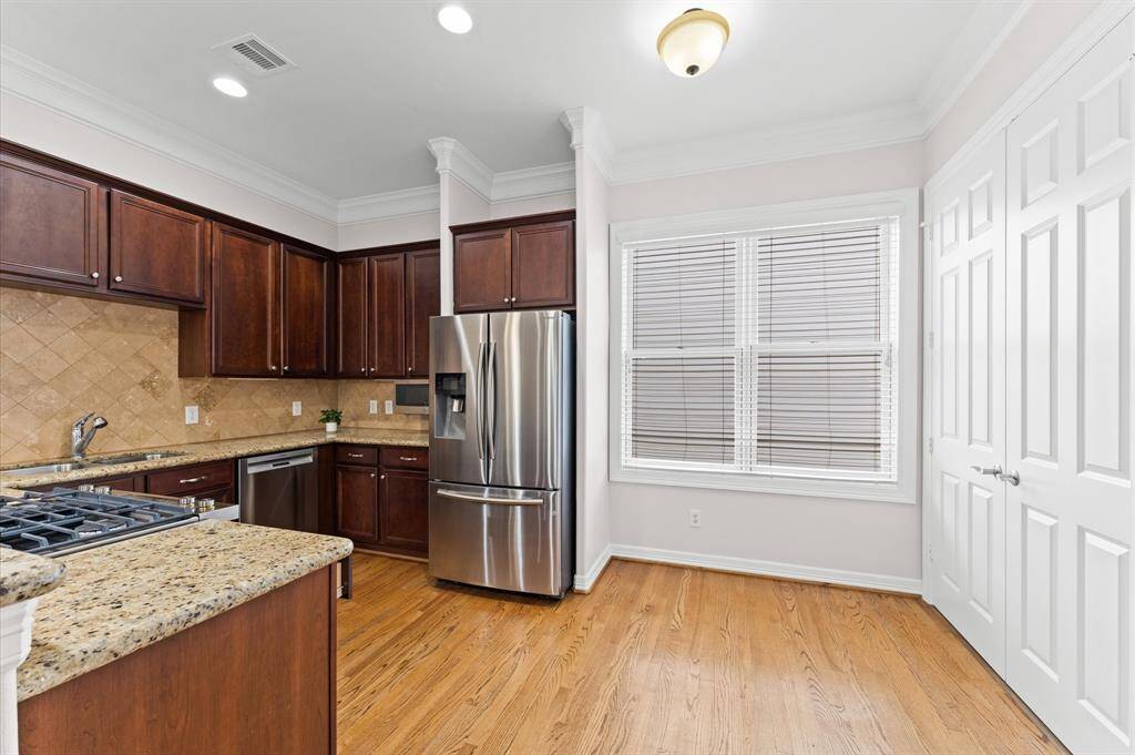 Kitchen has granite counters and gas stove and refrigerator is included