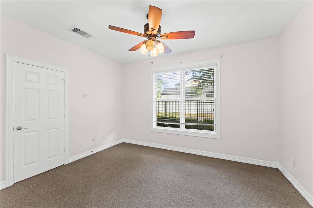 First floor private bedroom across from garage entry